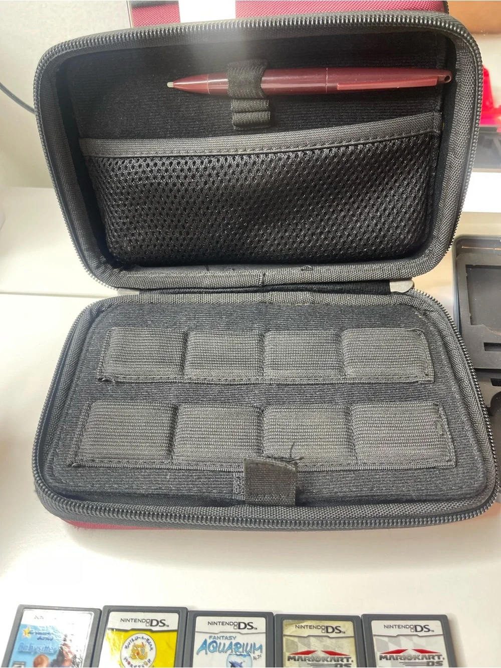 19 Nintendo DS games and Nintendo DS XL case with travel game cases and stylus